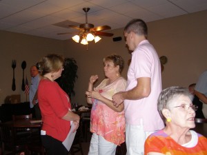 Recorder of Deeds Debbie Dunagan talking with Sharon Groeteke and Mark Paul at her campaign kick off event.