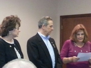 Club President Linda Van de Riet  swearing in our elected officers for 2014 . 1st Vice president Don Bickowski and Club Secretary Ellen Haynes at the December 2013 meeting.